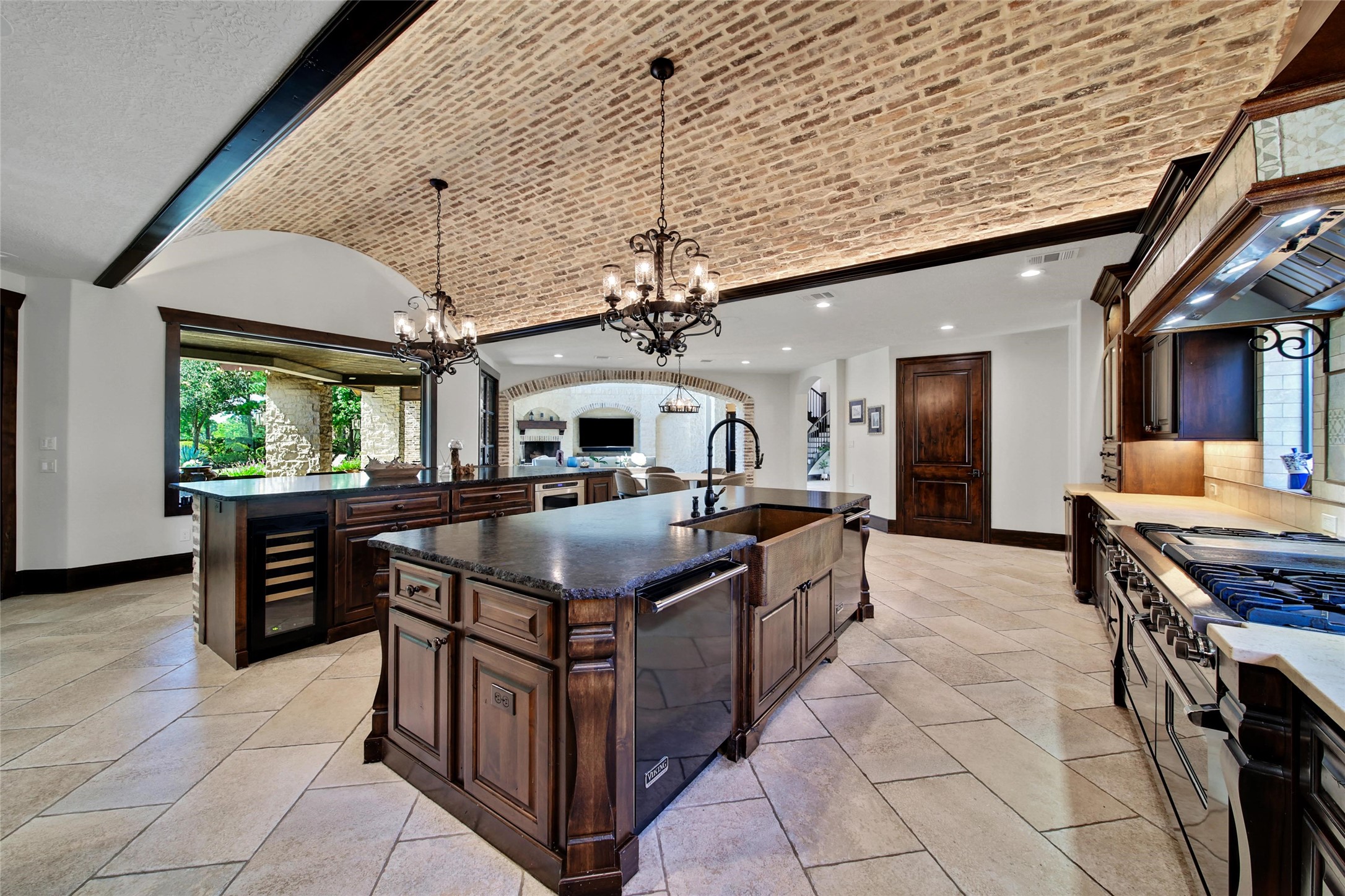2 Highclere Park Drive Spring, TX 77379 - Photo 9 of 50 There is abundant storage, prep, serving, and gathering space with dual islands featuring leathered-finished granite countertops on both islands.