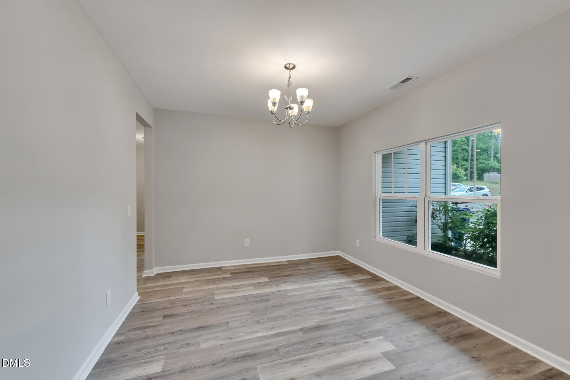 5317 Fayetteville Road, Unit A Durham, NC 27713 - Photo 10 of 50 wooden floor in an empty room with a window