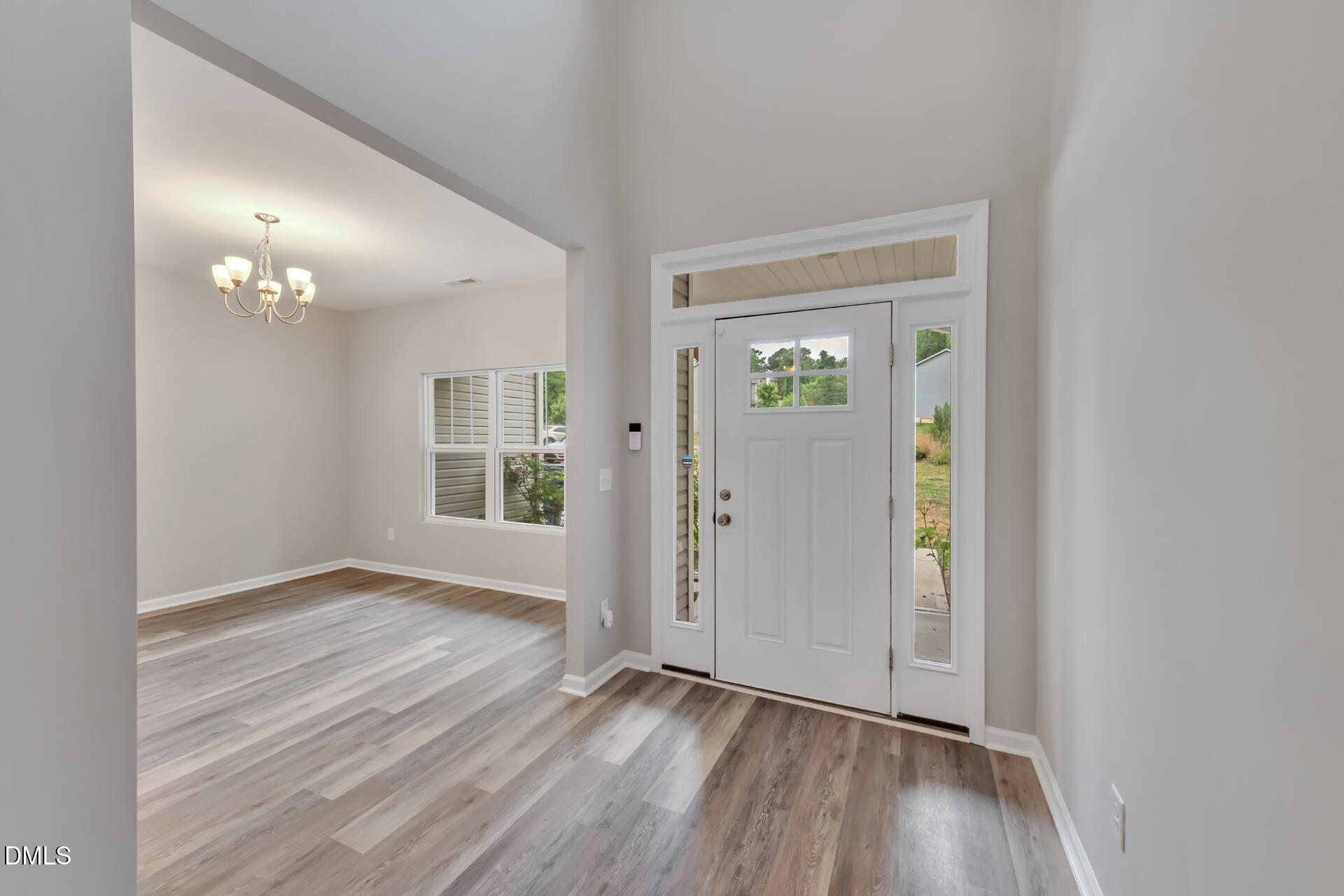 5317 Fayetteville Road, Unit A Durham, NC 27713 - Photo 11 of 50 an empty room with wooden floor and windows