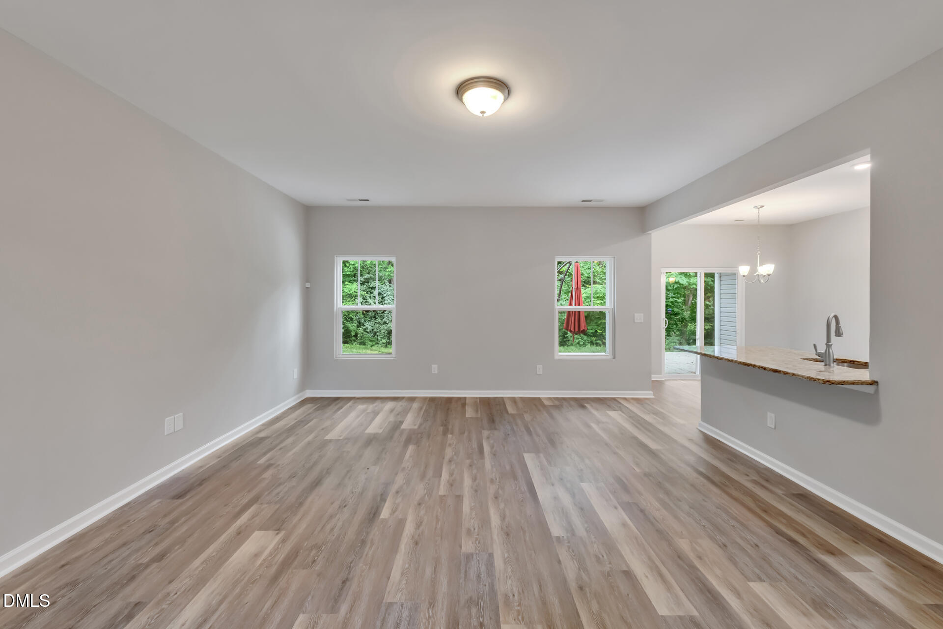 5317 Fayetteville Road, Unit A Durham, NC 27713 - Photo 13 of 50 an empty room with wooden floor and windows