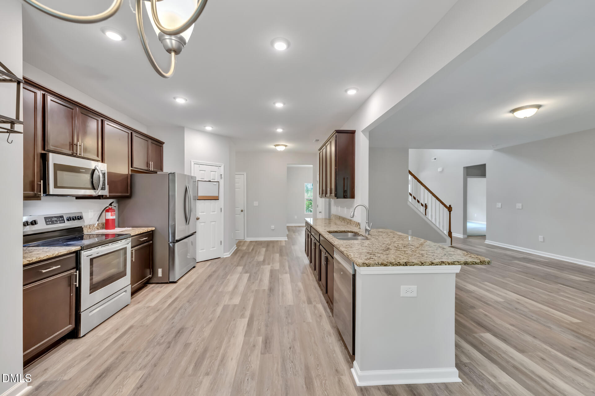 5317 Fayetteville Road, Unit A Durham, NC 27713 - Photo 19 of 50 a kitchen with stainless steel appliances granite countertop a sink stove and refrigerator