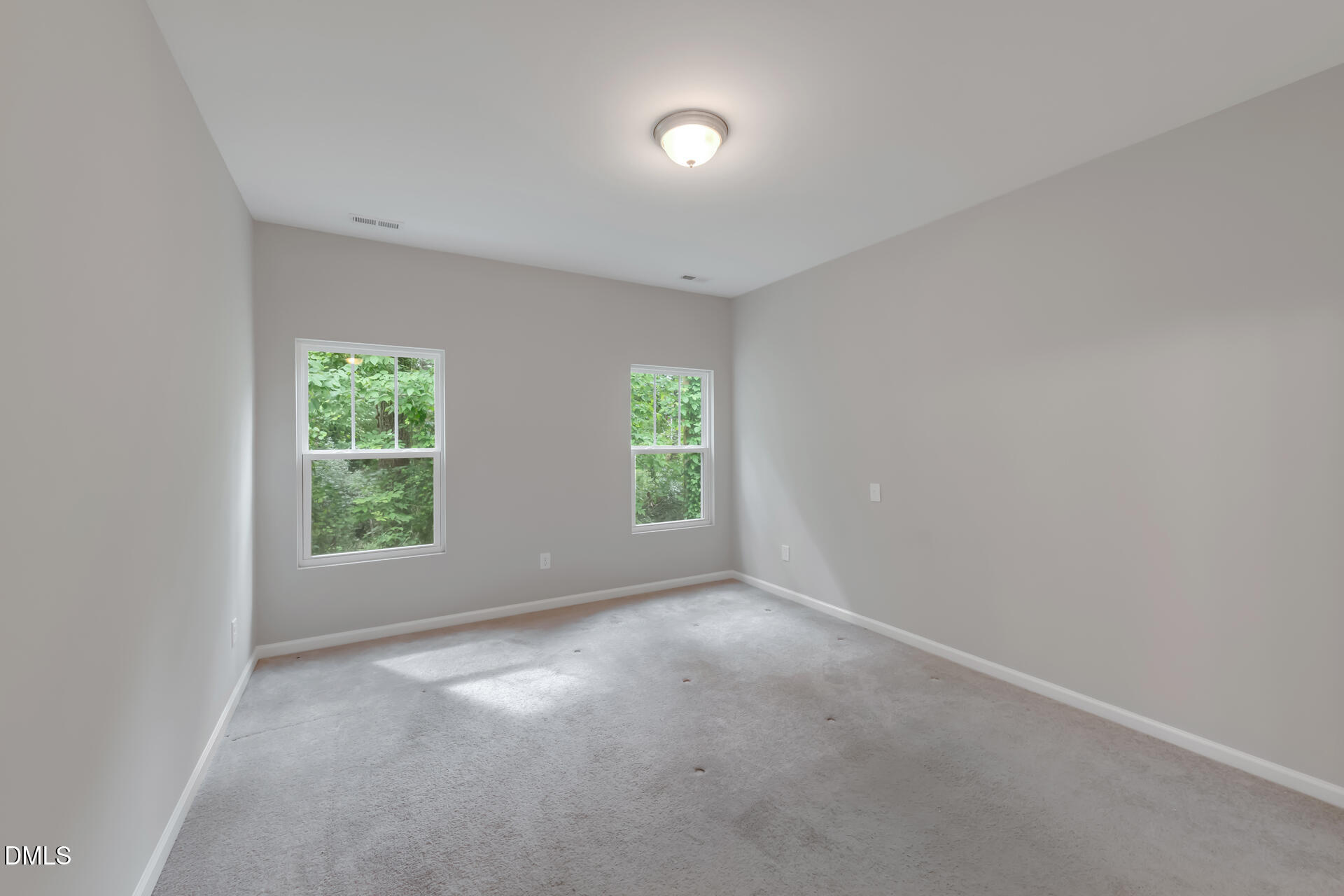 5317 Fayetteville Road, Unit A Durham, NC 27713 - Photo 24 of 50 an empty room with windows