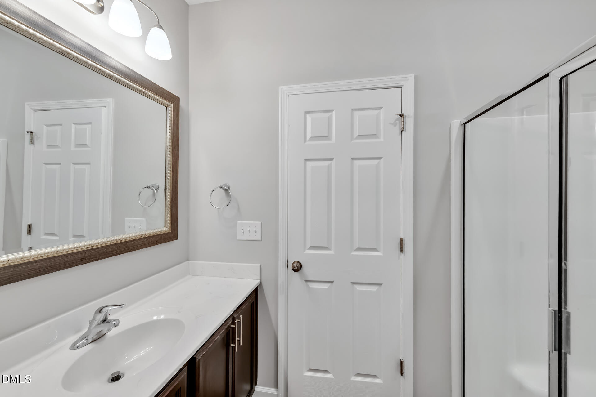 5317 Fayetteville Road, Unit A Durham, NC 27713 - Photo 27 of 50 a bathroom with a sink vanity and a mirror