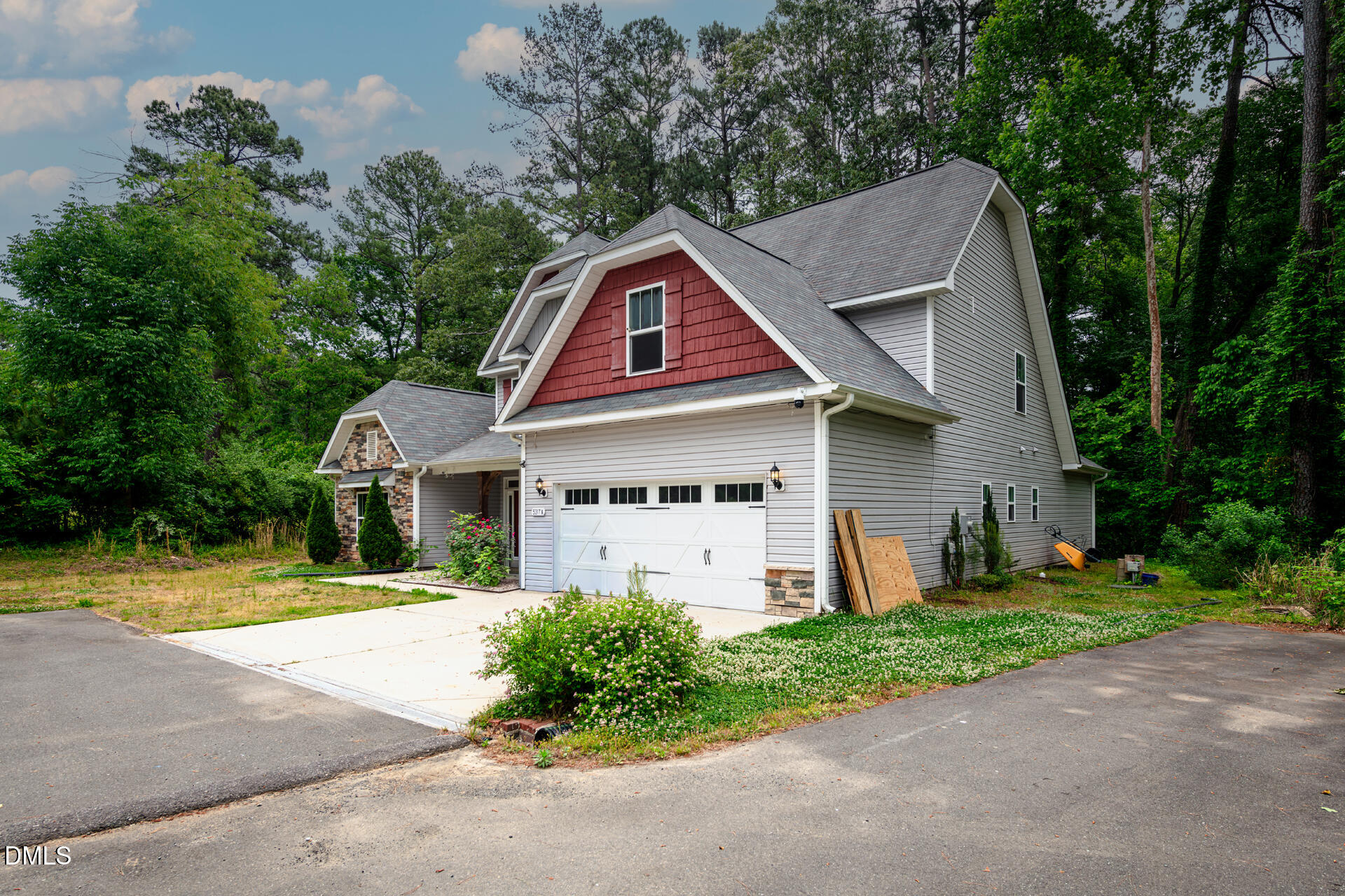 5317 Fayetteville Road, Unit A Durham, NC 27713 - Photo 6 of 50 a front view of a house with a yard and garage