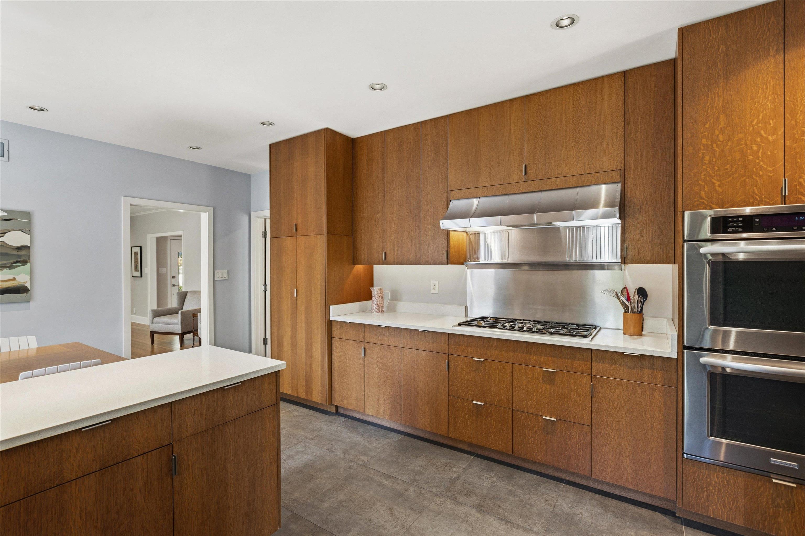 140 South Grove Park Road Memphis, TN 38117 - Photo 17 of 40 Kitchen featuring stainless steel appliances, light countertops, recessed lighting, and wood finish cabinetry