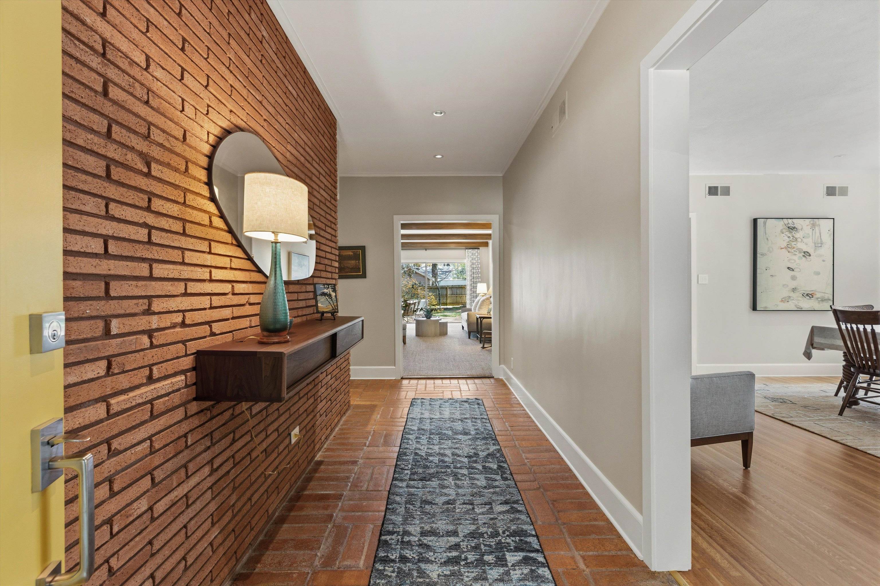 140 South Grove Park Road Memphis, TN 38117 - Photo 7 of 40 Hall with brick floors and floating table