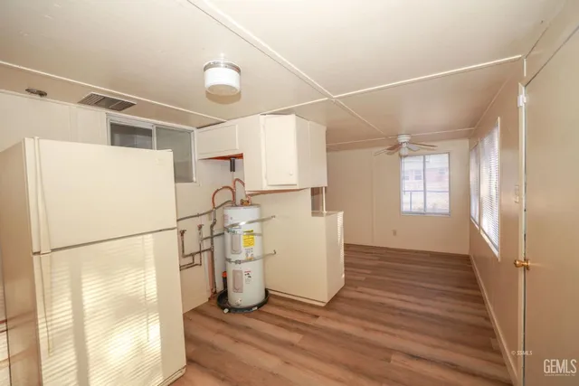 a view of storage and utility room with a window