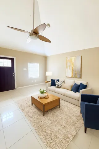 a living room with furniture and window