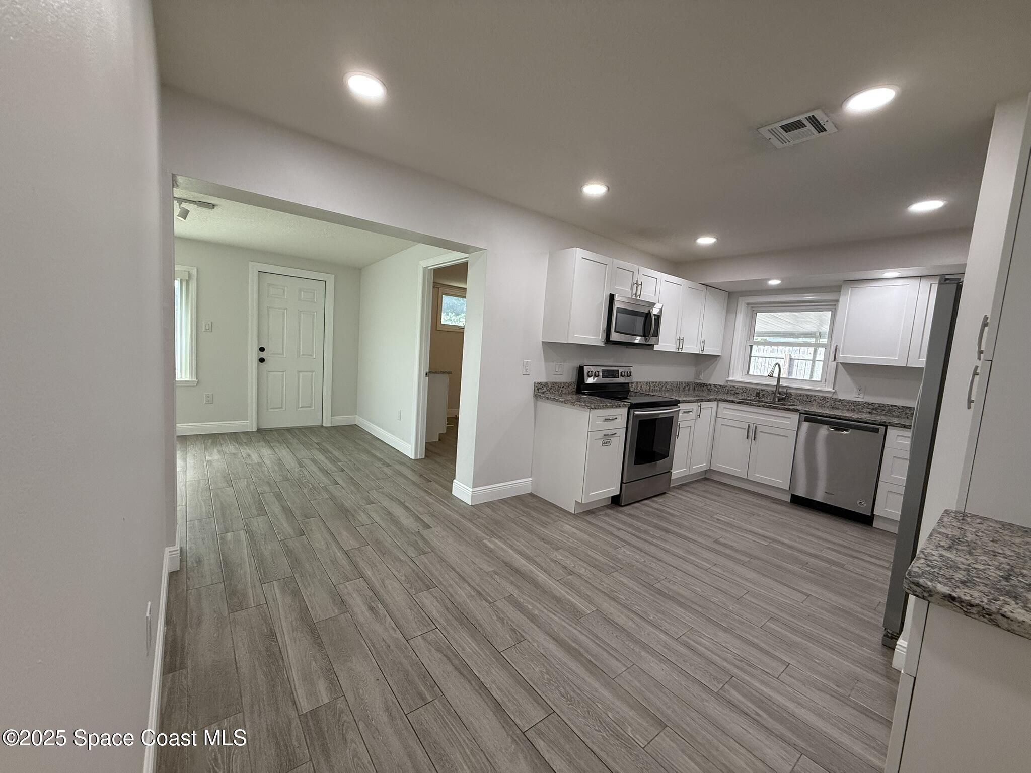 2801 Lorna Drive Melbourne, FL 32935 - Photo 15 of 25 a view of kitchen with wooden floor