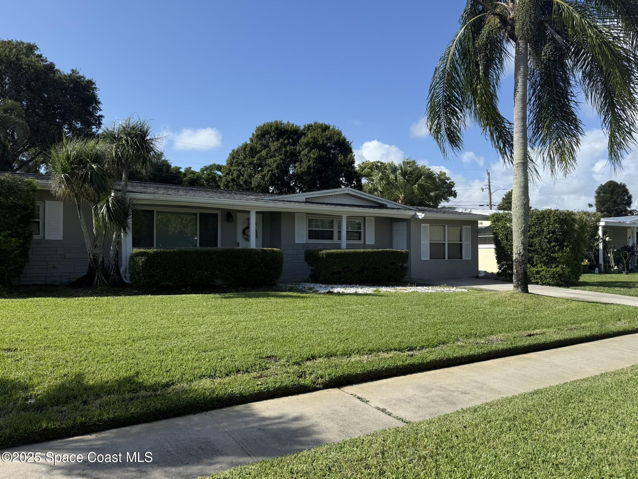 2801 Lorna Drive Melbourne, FL 32935 - Photo 2 of 25 a view of a house with a yard