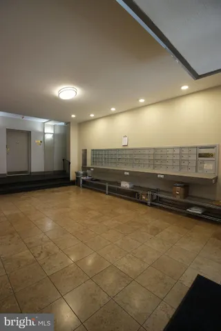 a lobby with furniture and a large window