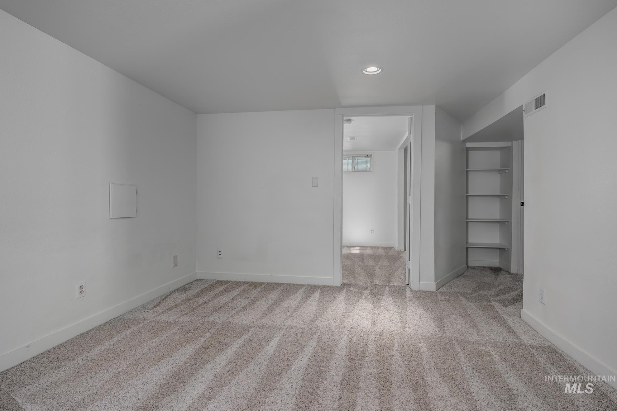 1016 West 5th Street Weiser, ID 83672 - Photo 19 of 36 Spare room with light carpet and recessed lighting