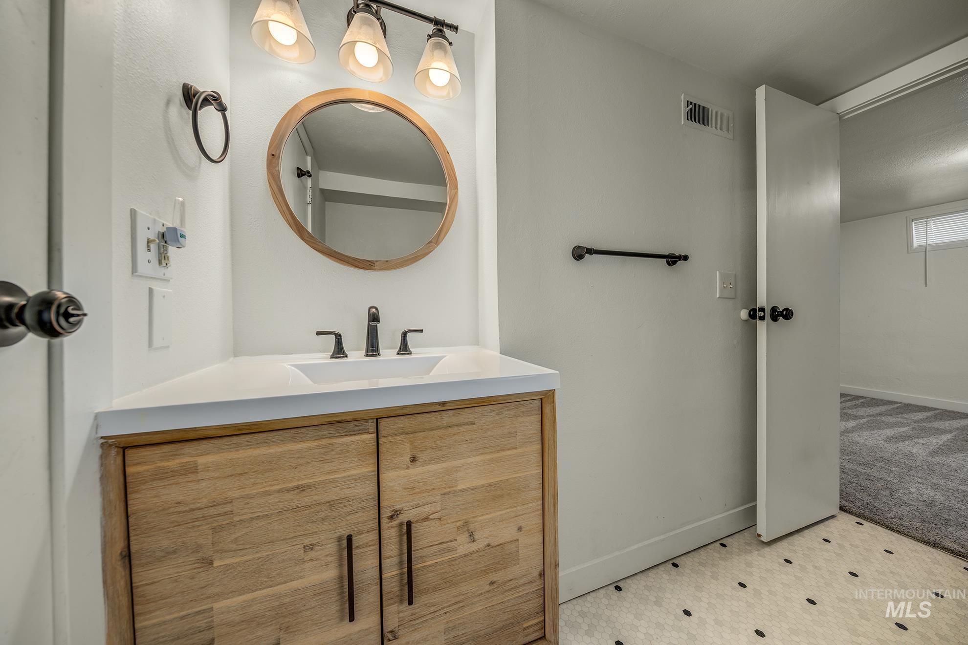 1016 West 5th Street Weiser, ID 83672 - Photo 22 of 36 Bathroom with vanity and baseboards