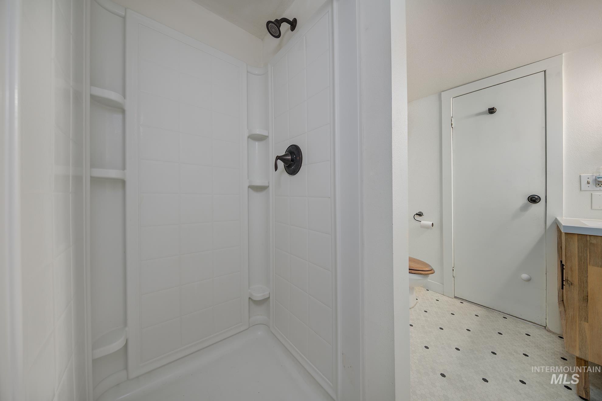 1016 West 5th Street Weiser, ID 83672 - Photo 23 of 36 Bathroom with light floors and a stall shower