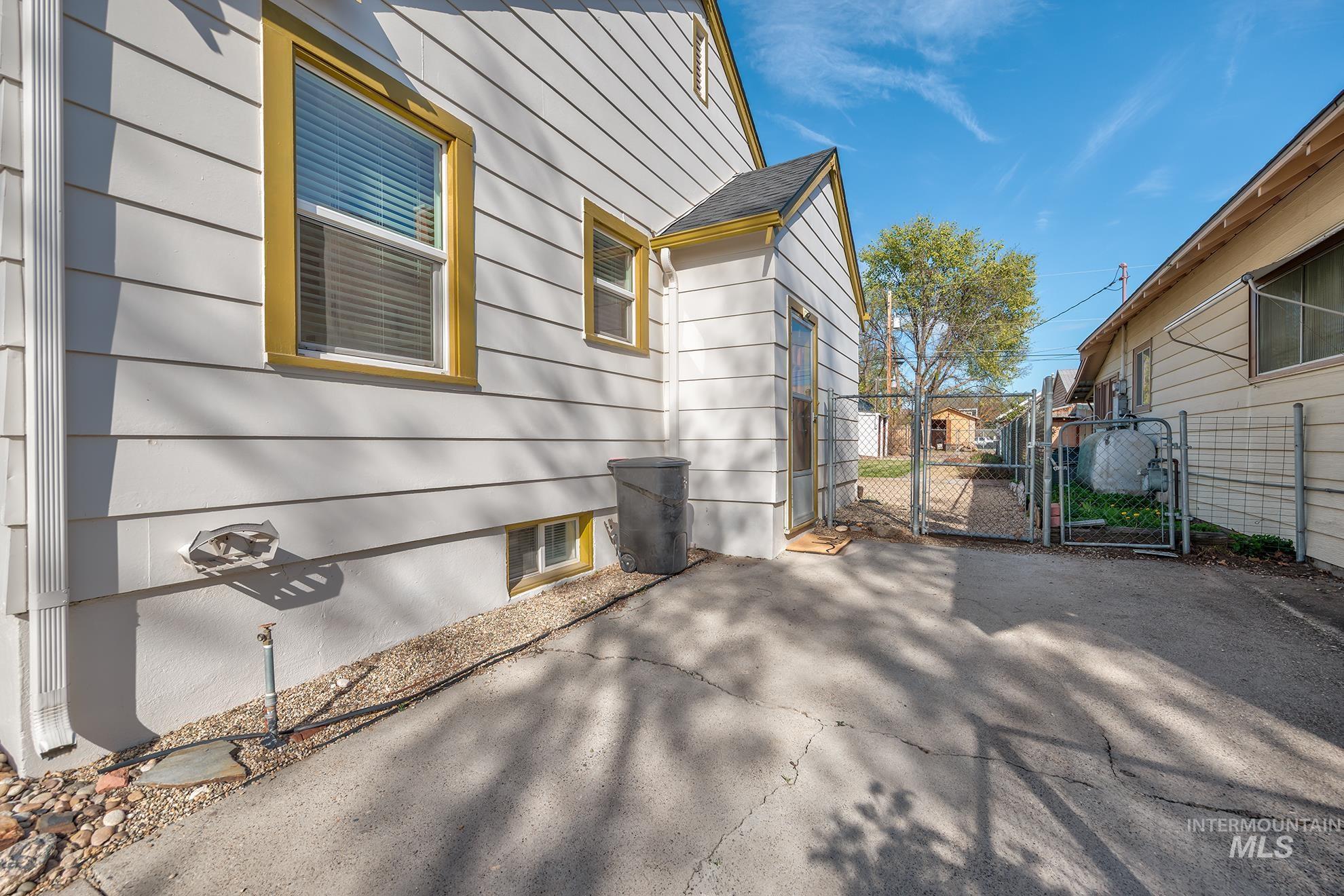 1016 West 5th Street Weiser, ID 83672 - Photo 25 of 36 View of property exterior featuring a gate and a patio