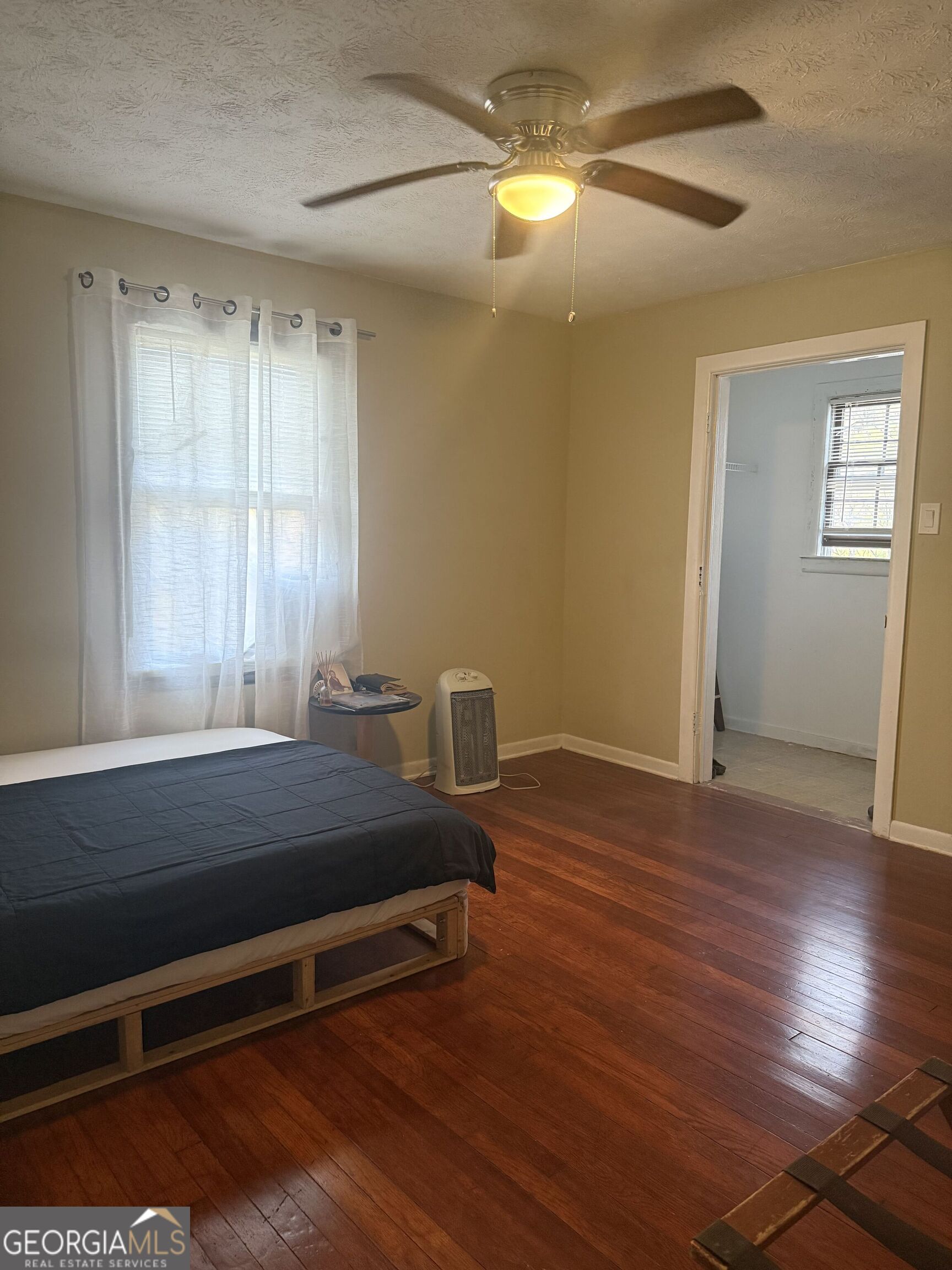 3861 Newnan Road Griffin, GA 30223 - Photo 15 of 89 a room with wooden floor and windows