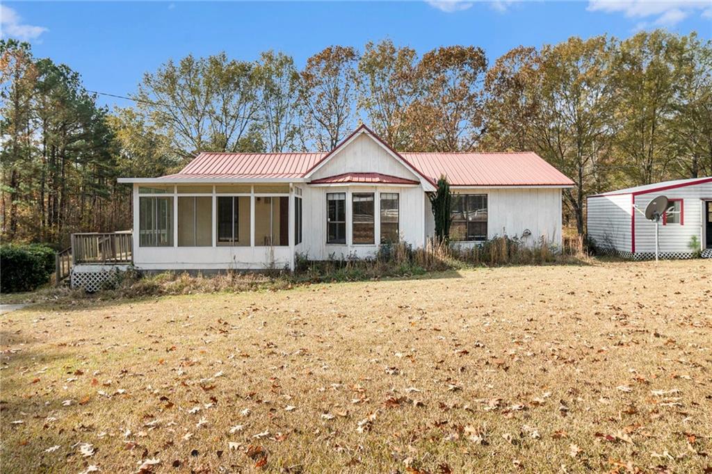 7703 Blacks Bluff Road Southwest Cave Spring, GA 30124 - Photo 1 of 1 a front view of a house with a yard covered with snow