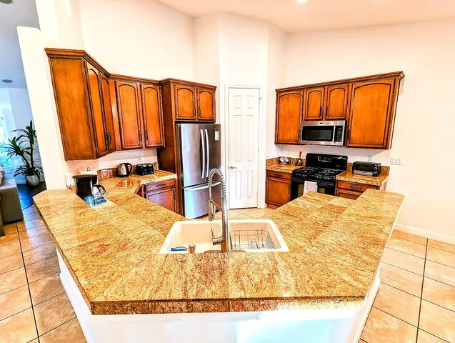 a bed sitting in a room next to a window