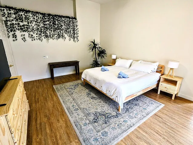 a bedroom with a bed and a table