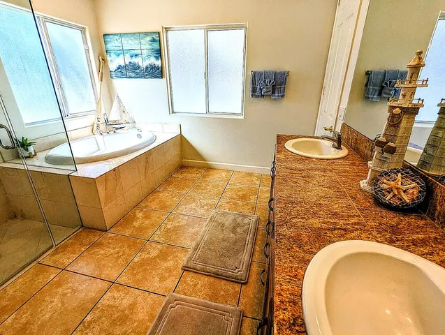 a bathroom with a sink mirror vanity and toilet