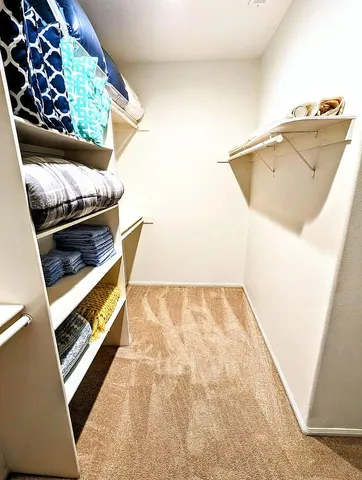 a view of an empty room and wooden floor