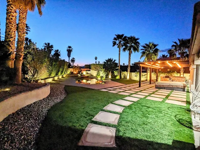 a view of a park with swings and slides