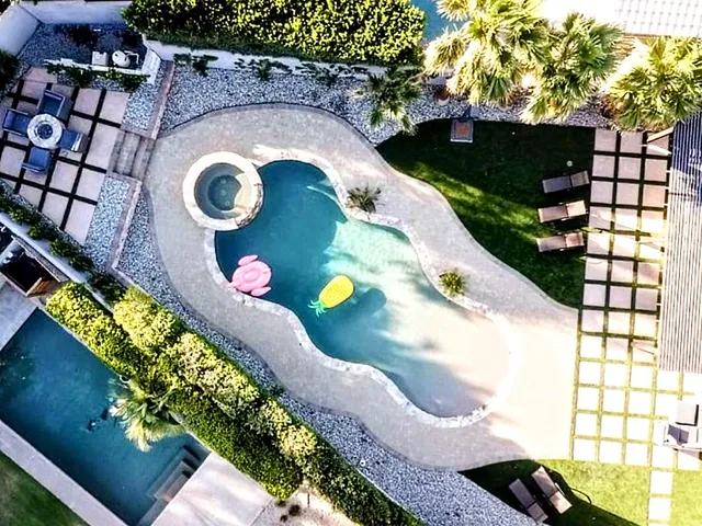 a view of swimming pool in a backyard