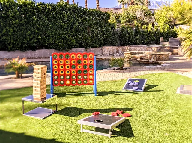 a view of swimming pool with seating area and trees around