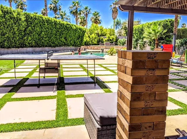 a view of swimming pool with a patio
