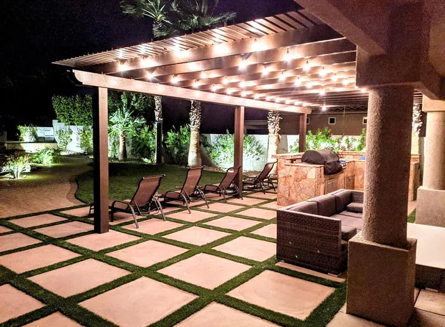 a view of a patio with a dining table and chairs