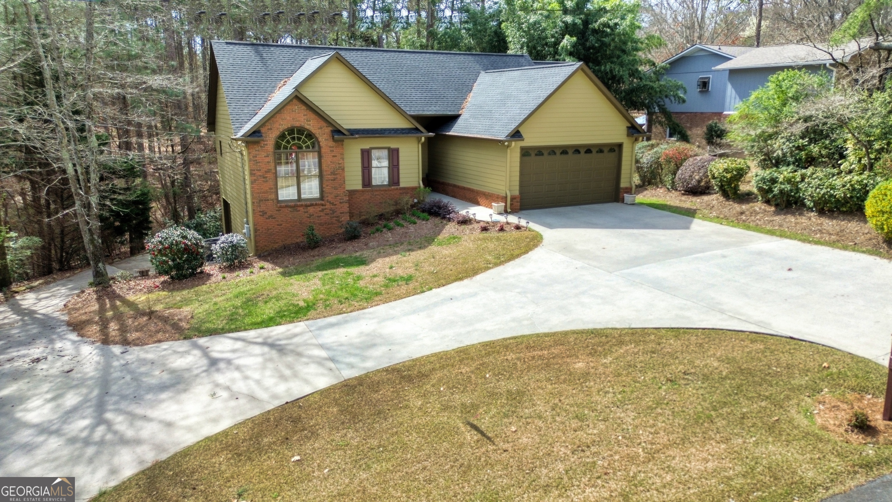 65 Quiet Acres Road Southwest Rome, GA 30165 - Photo 1 of 1 a front view of a house with a yard and garage