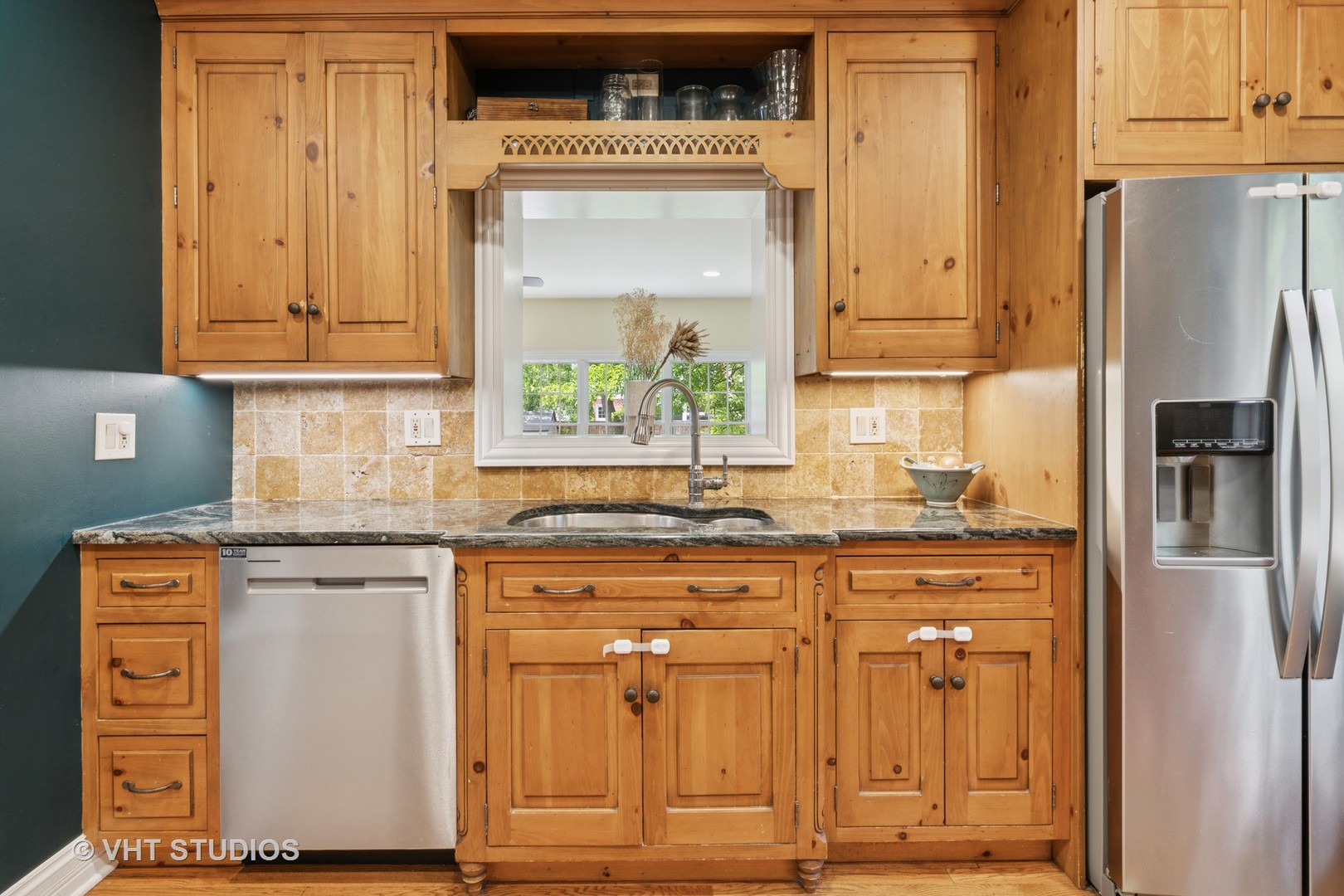 720 Beaver Road Glenview, IL 60025 - Photo 5 of 28 a kitchen with stainless steel appliances granite countertop a refrigerator and a stove
