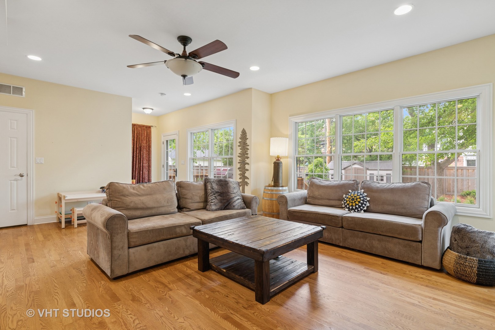 720 Beaver Road Glenview, IL 60025 - Photo 8 of 28 a living room with furniture and a large window with wooden floor