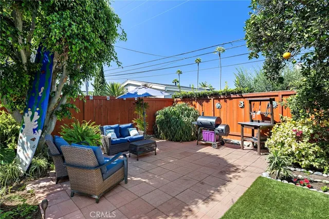 a view of a backyard with sitting area and furniture
