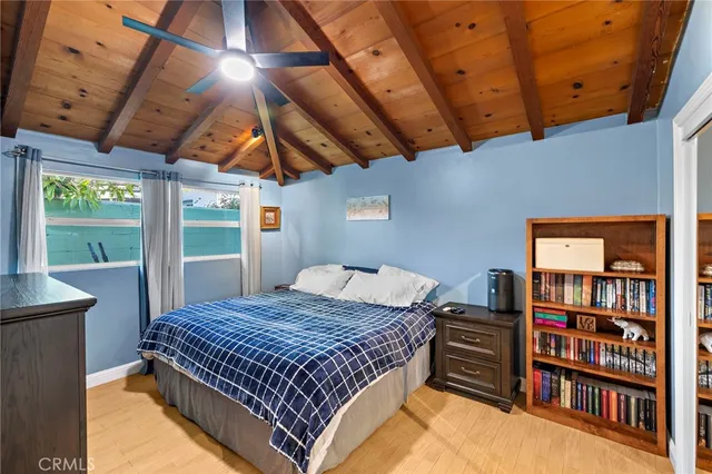 a bedroom with a bed and a book shelf