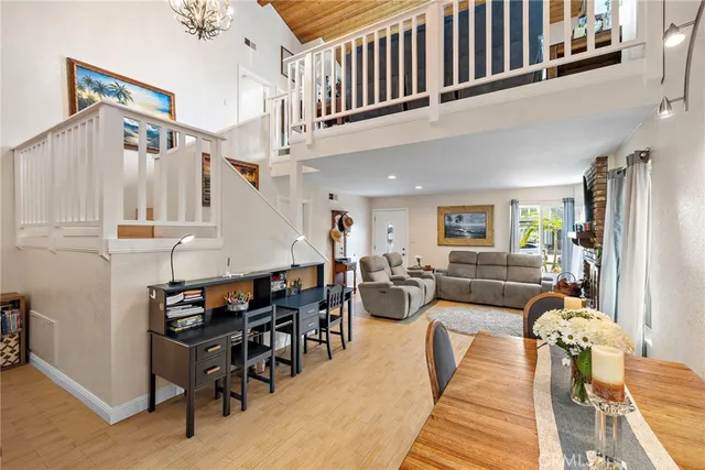 a living room with lots of furniture and a large window