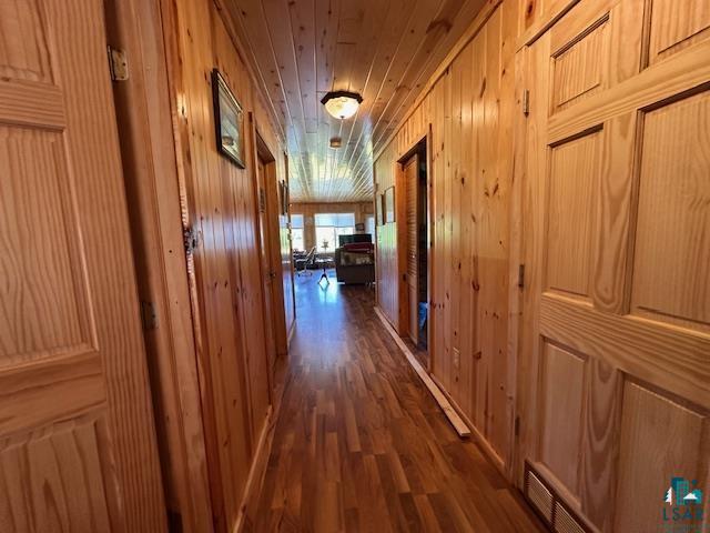 1383 Kelly Trail Isabella, MN 55607 - Photo 16 of 40 Corridor with dark wood finished floors and wood walls