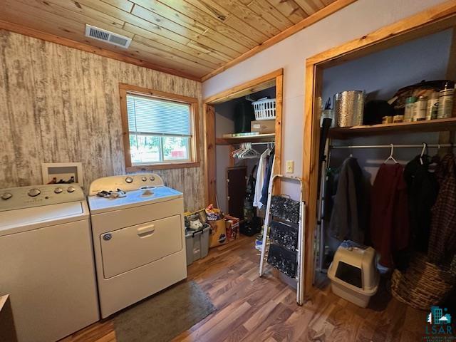 1383 Kelly Trail Isabella, MN 55607 - Photo 17 of 40 Laundry room featuring washer and clothes dryer, wood finished floors, and wooden ceiling