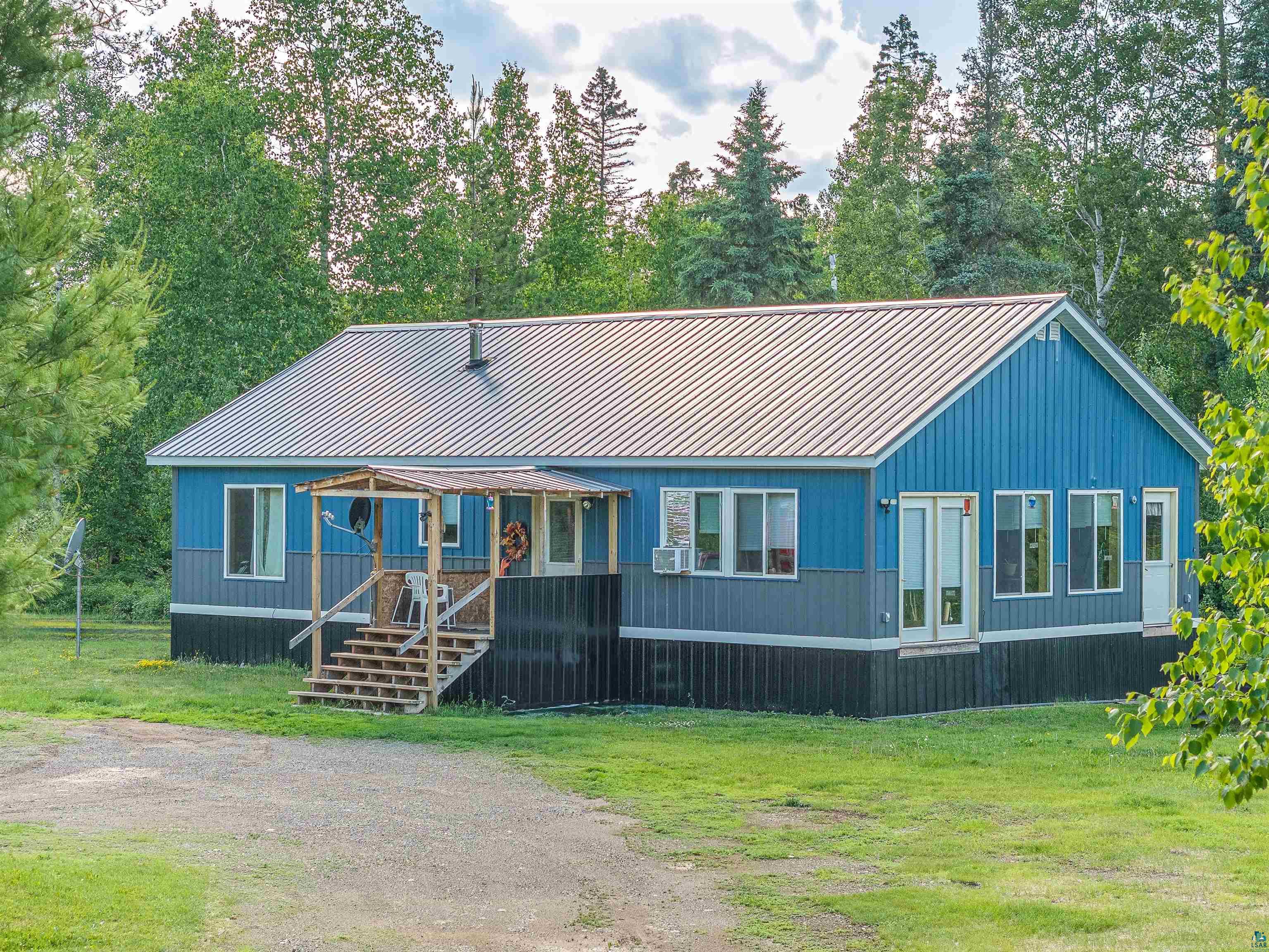 1383 Kelly Trail Isabella, MN 55607 - Photo 2 of 40 Manufactured / mobile home with covered porch, a front yard, and a metal roof