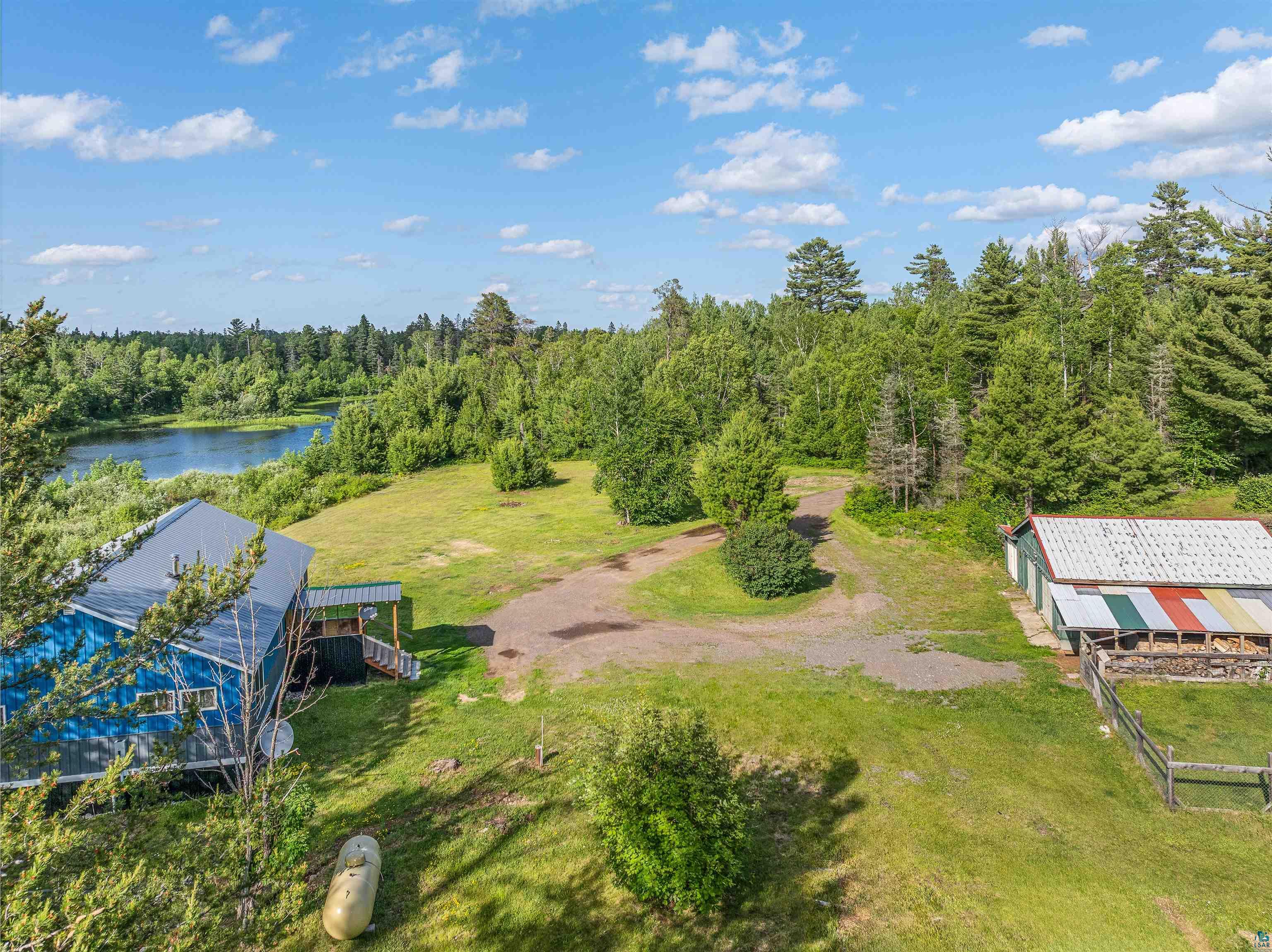 1383 Kelly Trail Isabella, MN 55607 - Photo 22 of 40 Aerial view of property and surrounding area with a large body of water and a forest