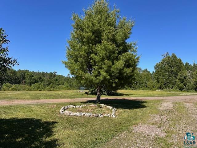 1383 Kelly Trail Isabella, MN 55607 - Photo 23 of 40 Surrounding community featuring a lawn and a forest view