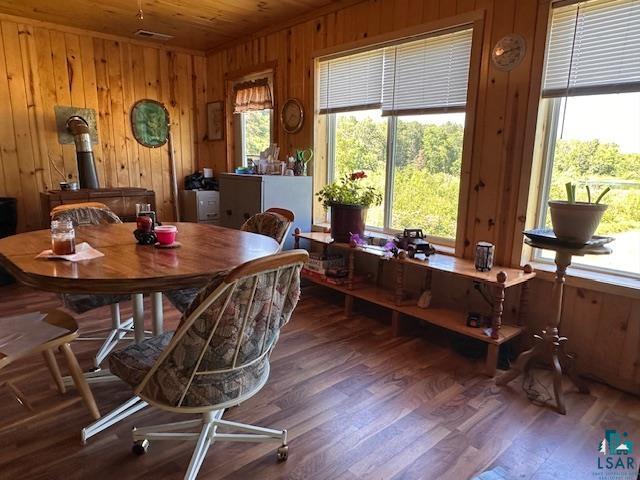 1383 Kelly Trail Isabella, MN 55607 - Photo 6 of 40 Dining area with wood walls, wood finished floors, and wood ceiling