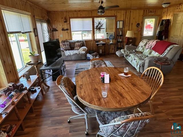1383 Kelly Trail Isabella, MN 55607 - Photo 9 of 40 Dining room featuring wooden walls, wood finished floors, and wooden ceiling