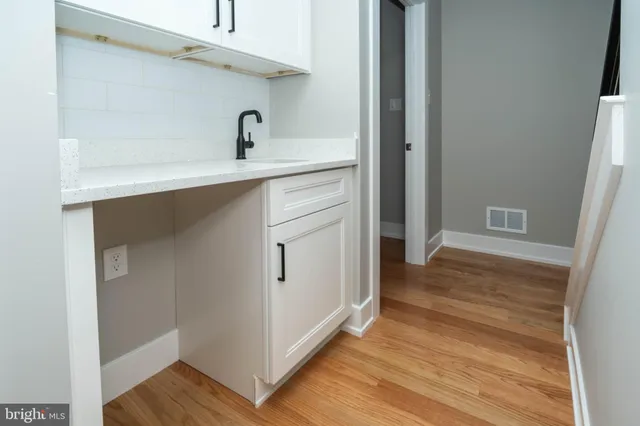 a hallway with wooden floor