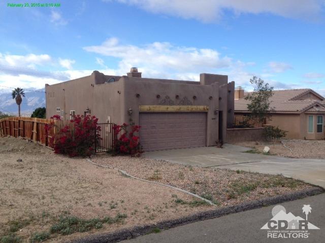 66857 San Bruno Road Desert Hot Springs, CA 92240 - Photo 2 of 5 a view of a house with a backyard