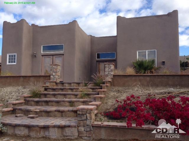 66857 San Bruno Road Desert Hot Springs, CA 92240 - Photo 5 of 5 a front view of a house with a yard