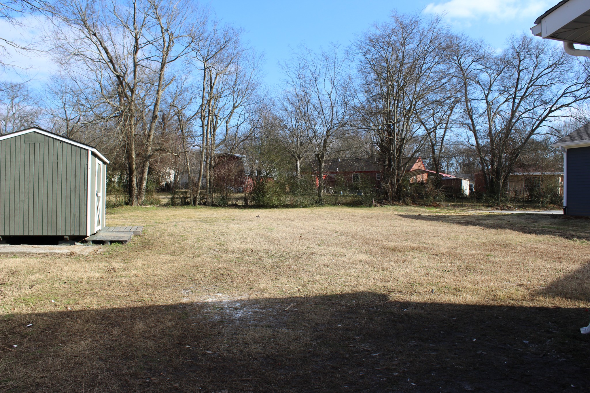 521 Forest Park Road Madison, TN 37115 - Photo 15 of 15 a backyard of a house with large trees