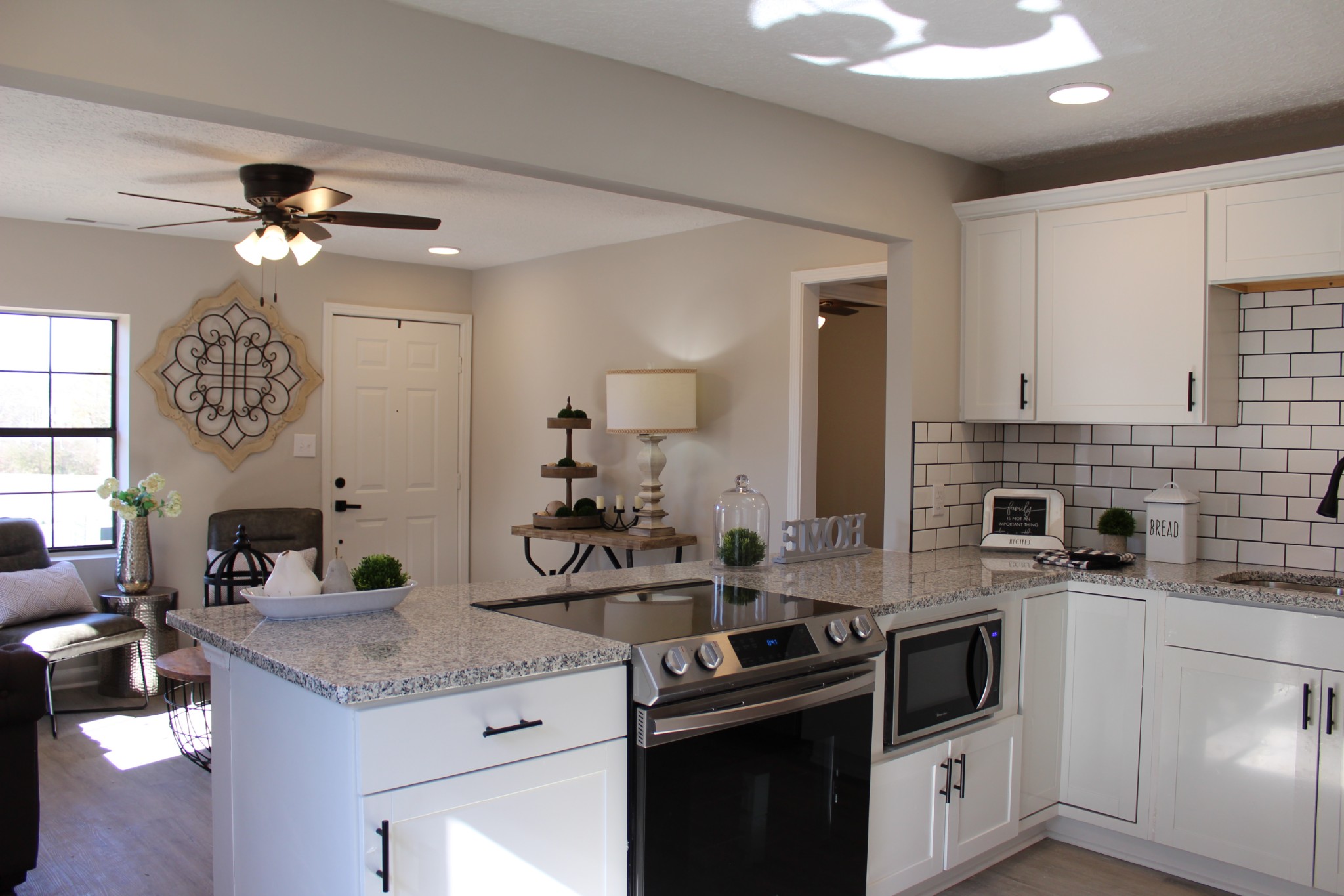 521 Forest Park Road Madison, TN 37115 - Photo 5 of 15 a kitchen with a stove cabinets and window