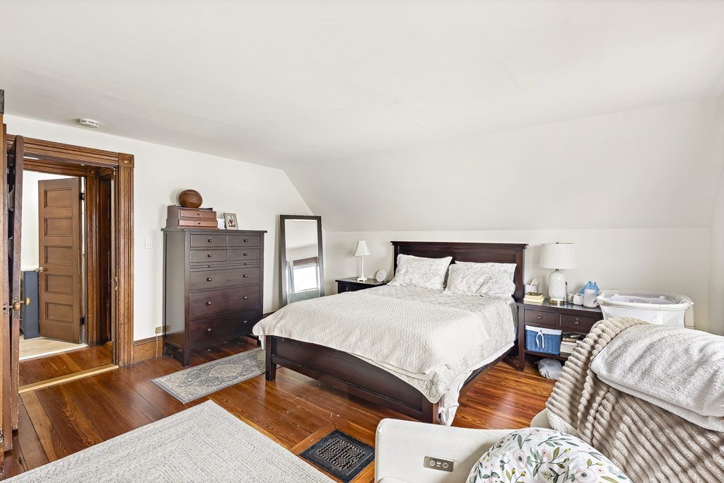 55 Main Street Somerville, MA 02145 - Photo 26 of 28 a bedroom with a bed and a couch