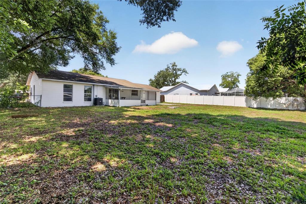 2340 Merrily Circle South Seffner, FL 33584 - Photo 43 of 52 a view of a house with a big yard